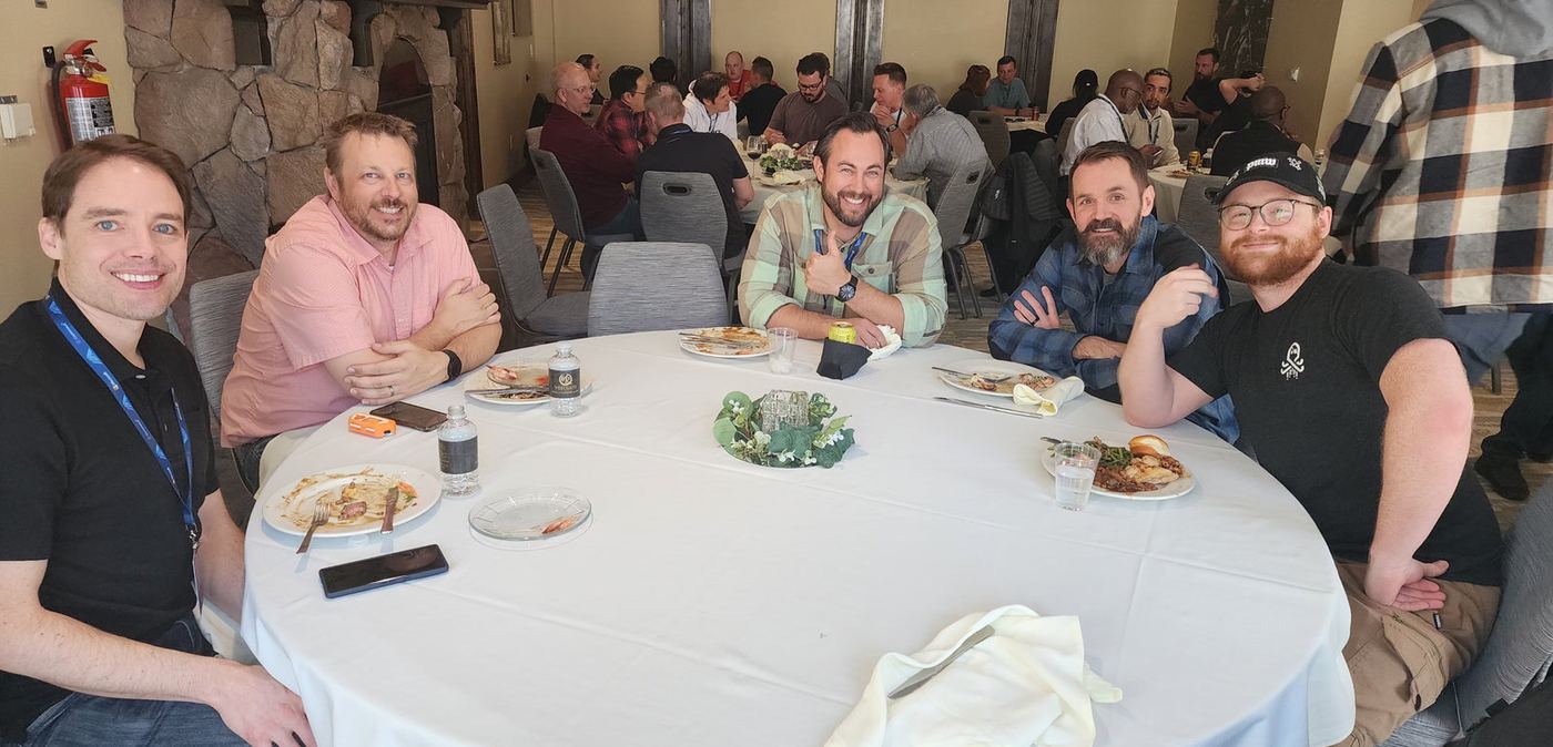 Attendees at a lunch table at the 2024 summit