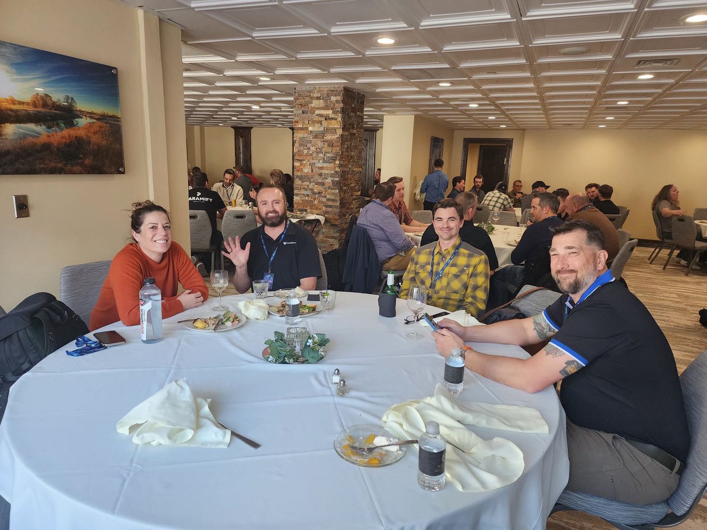 Attendees talking over lunch at round tables